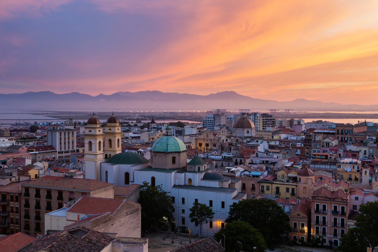 Waterfront cityscape at sunset, Cagliari, Provincia di Cagliari, Italy,