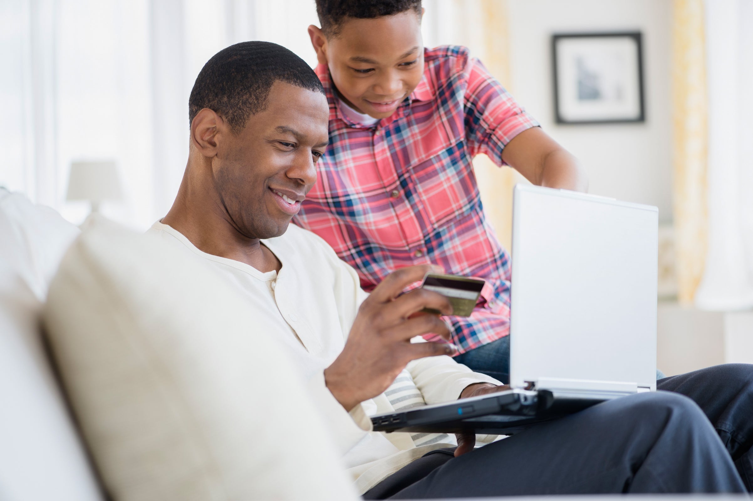 Father and son shopping online