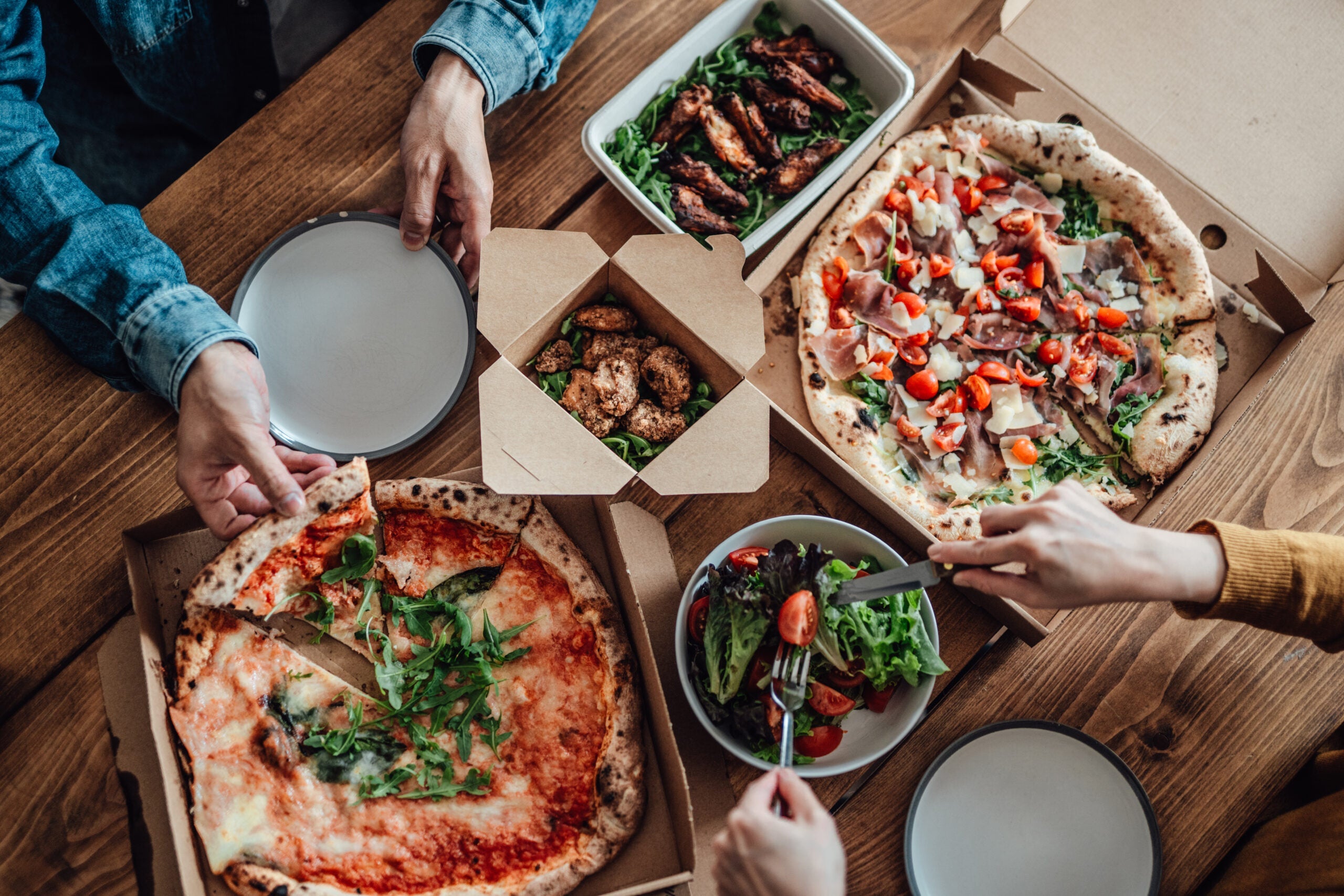 Couple sharing takeaway meal at home