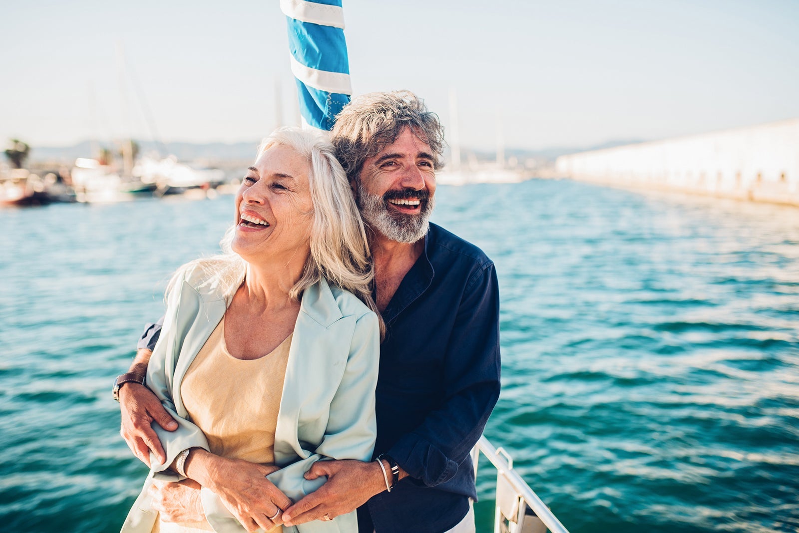 Portrait of a senior couple enjoying cruising on their yacht.