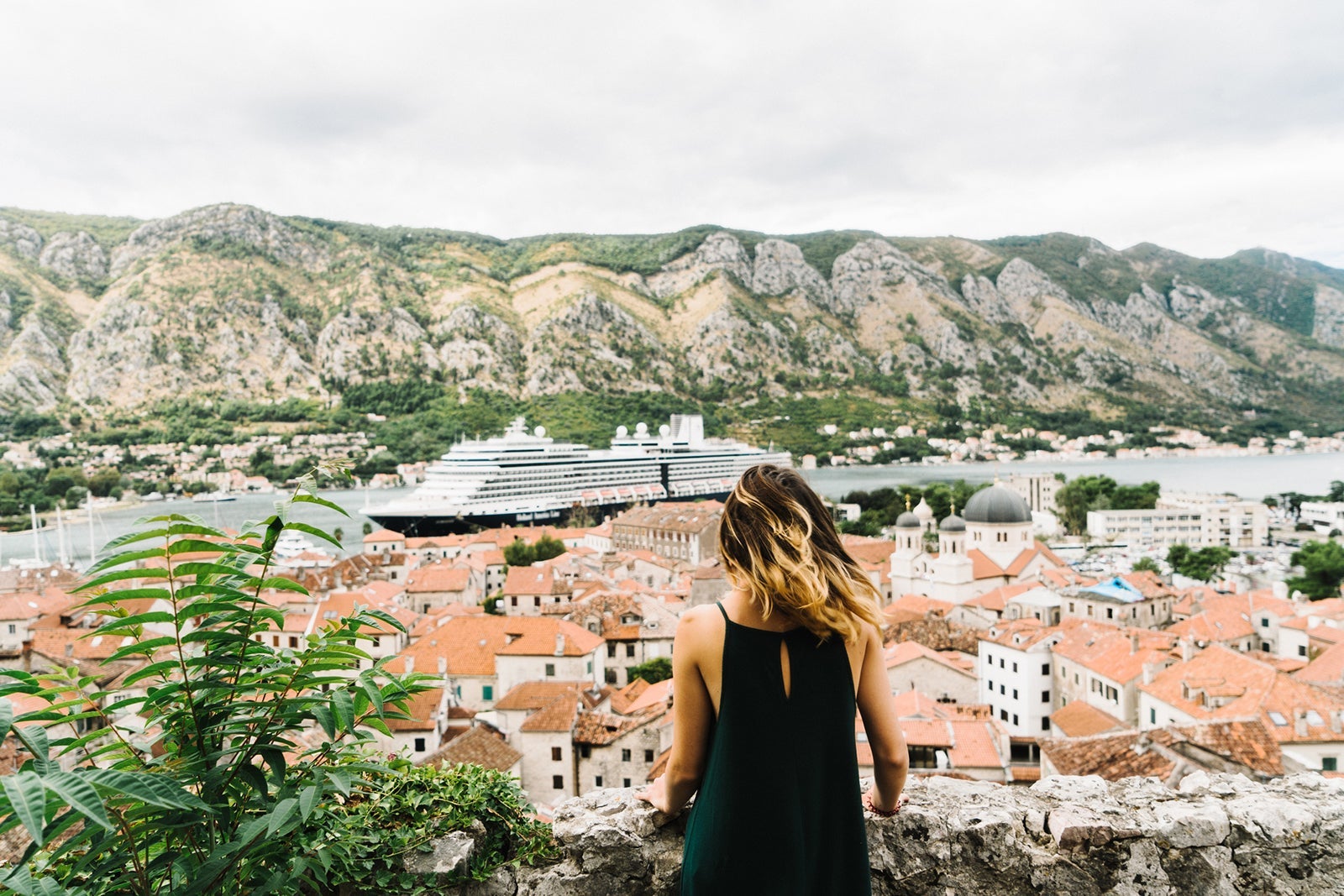 Woman on the background of Kotor