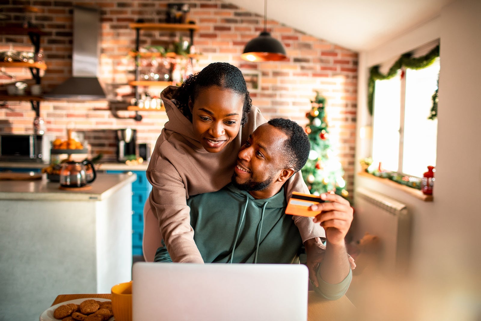 Young couple doing online Christmas shopping