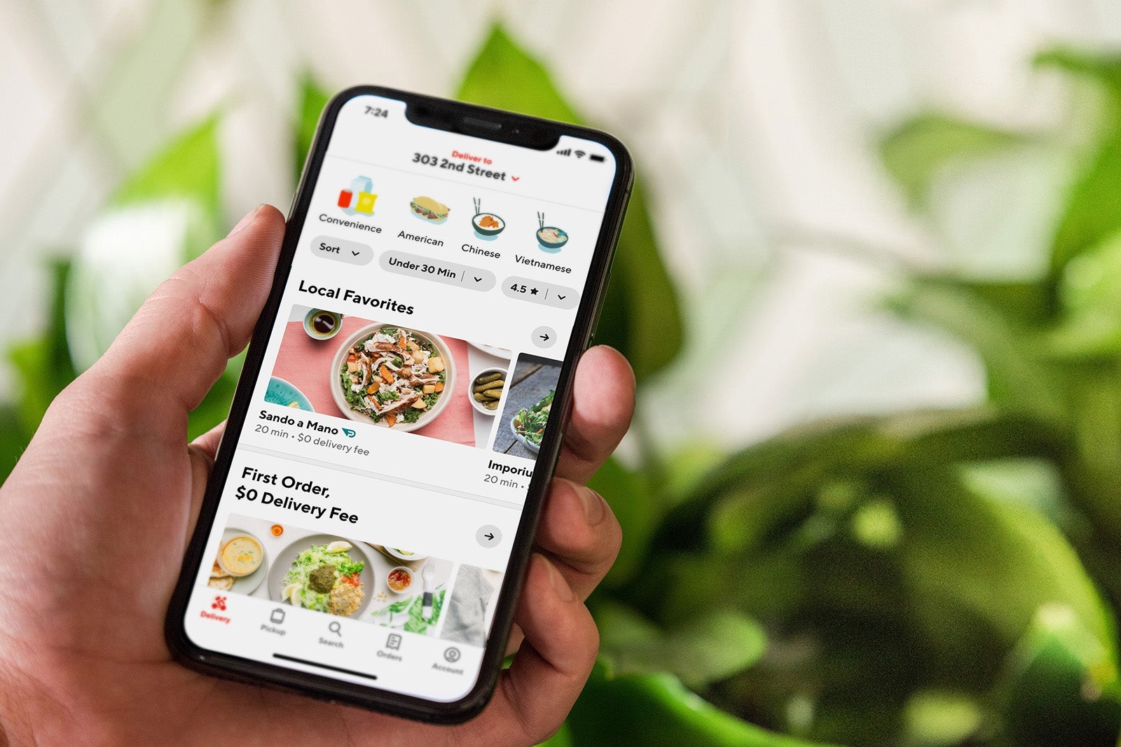 Hand holding smartphone with DoorDash App