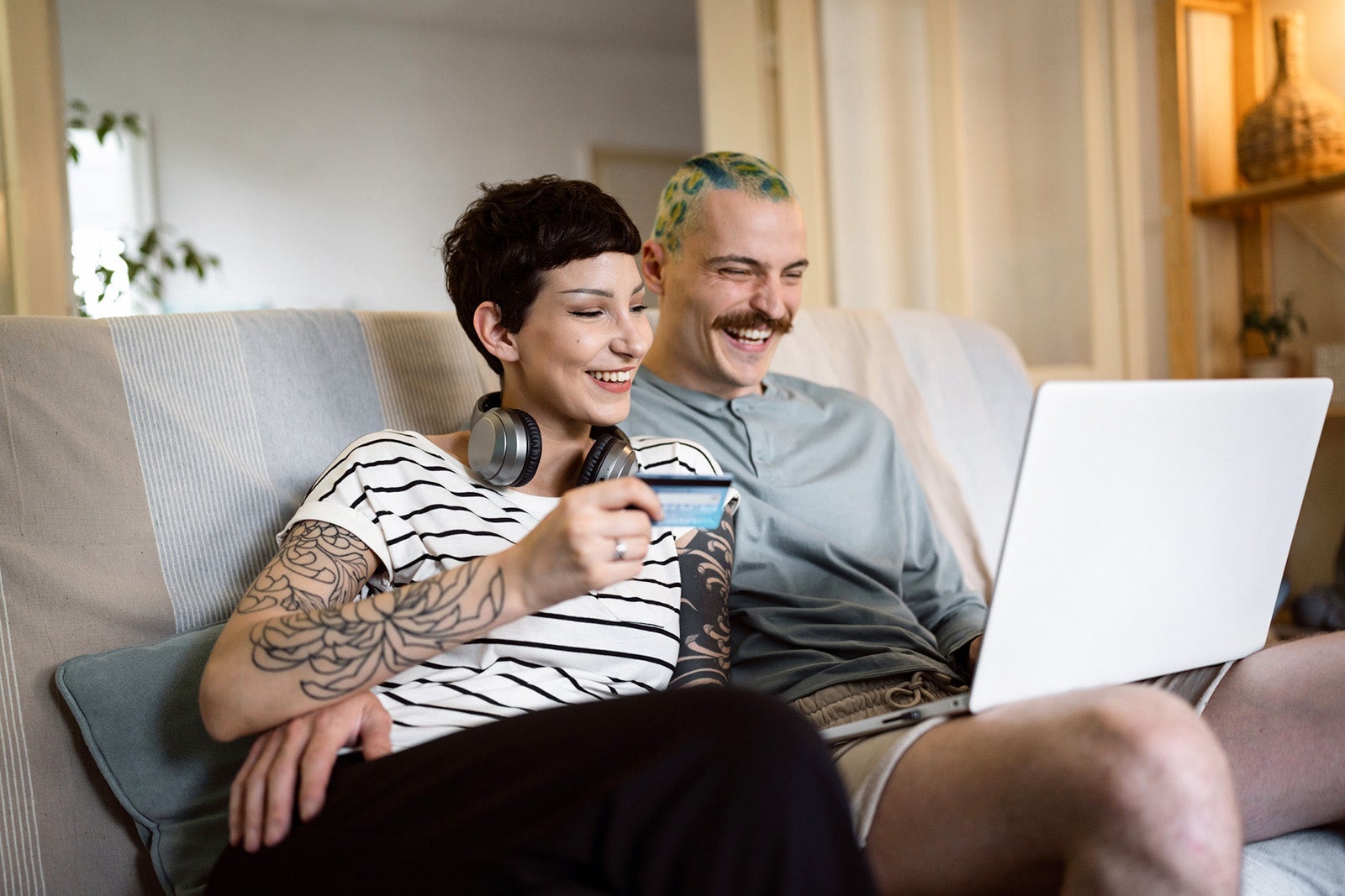 Urban young couple online shopping even during economic inflation