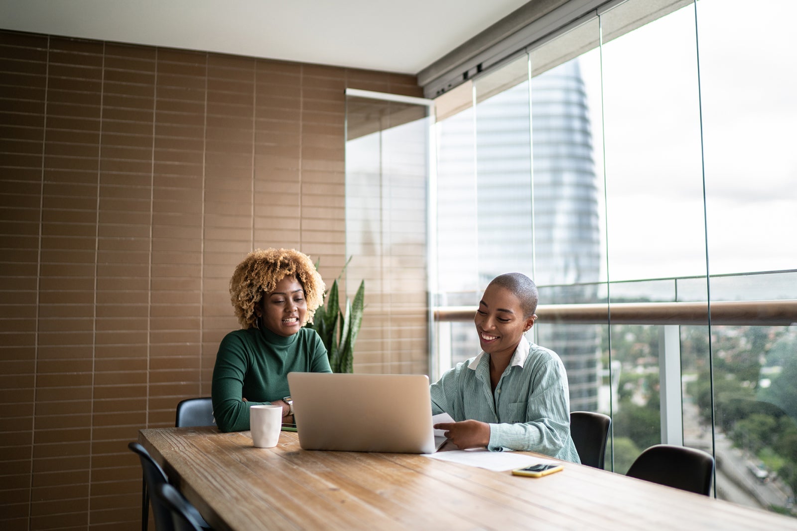 Financial advisor or real estate agent talking to customer at home