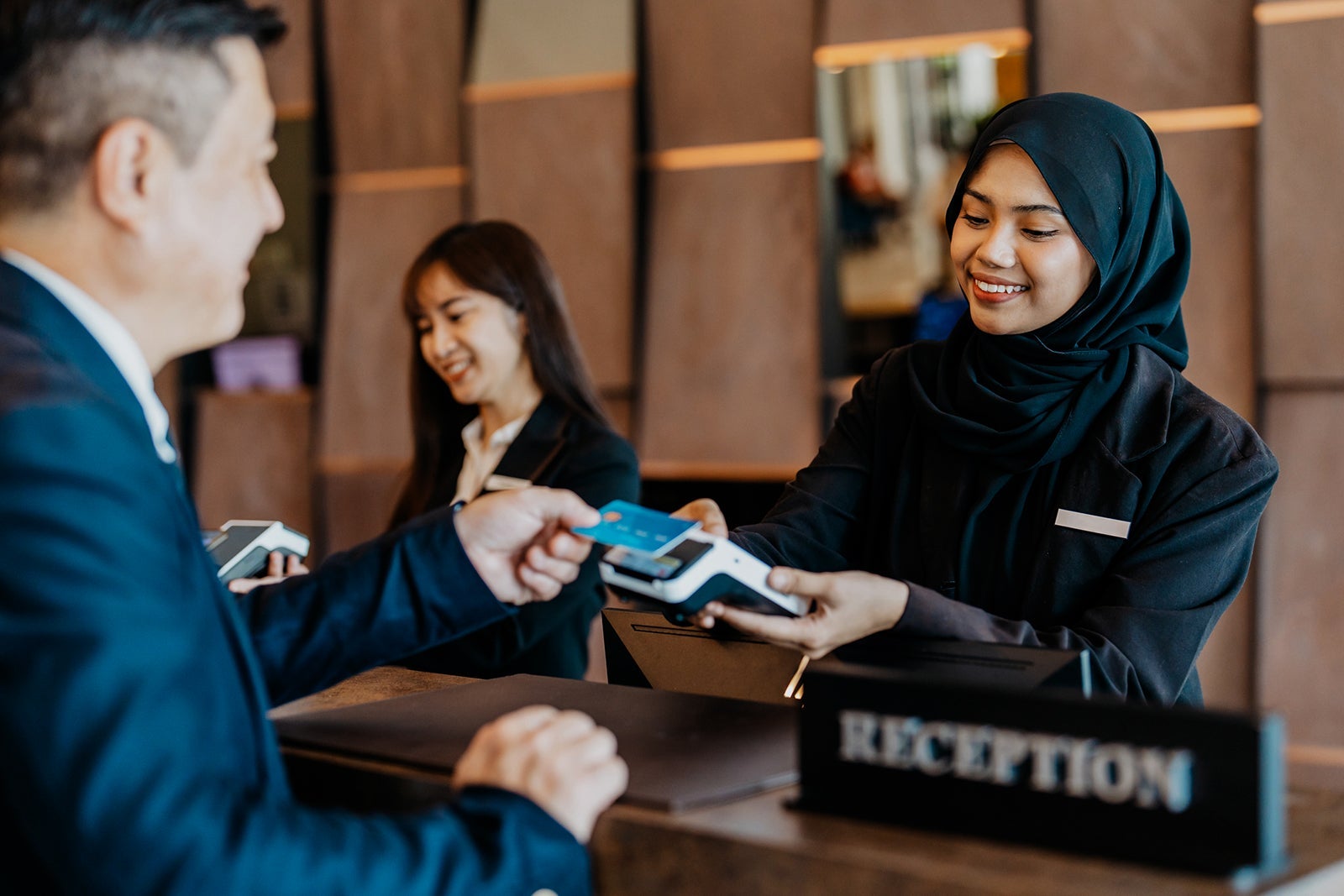 Credit card contactless payment at hotel reception