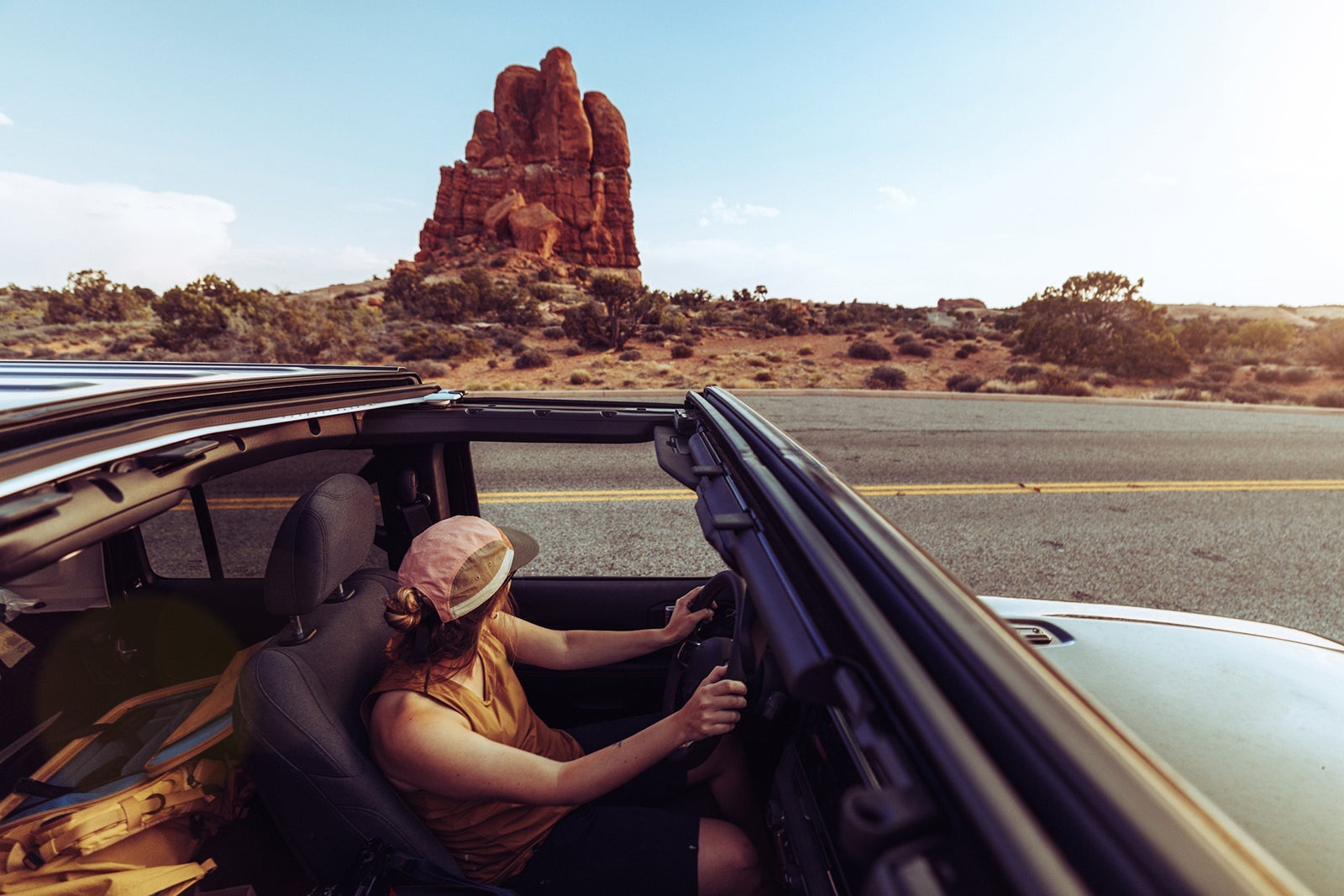 Woman driving offroad car in Arches National Park