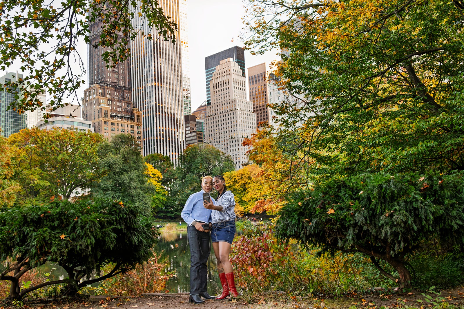 Female couple taking selfie in Central Park in Autumn