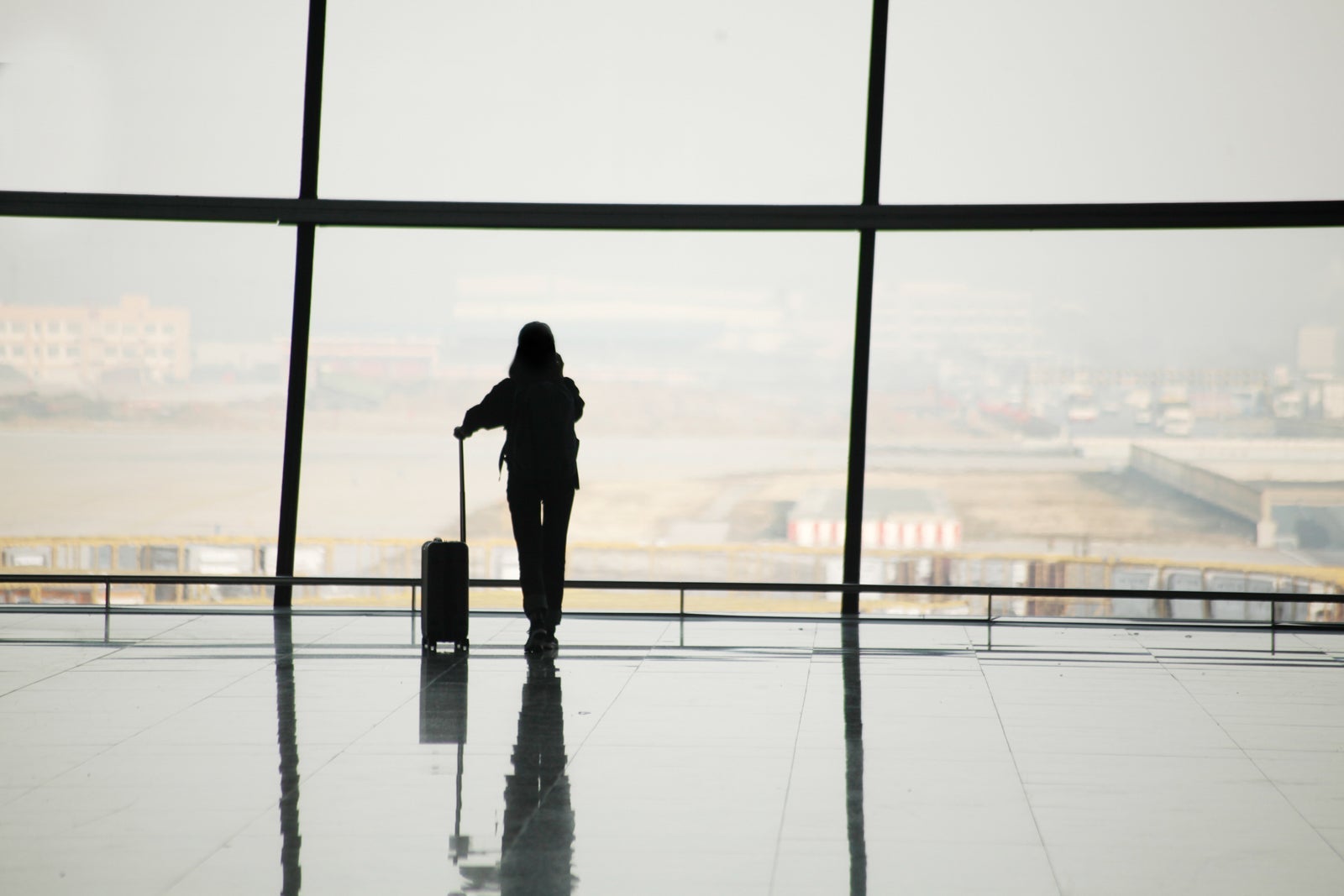 Silhouette of travelers in airport