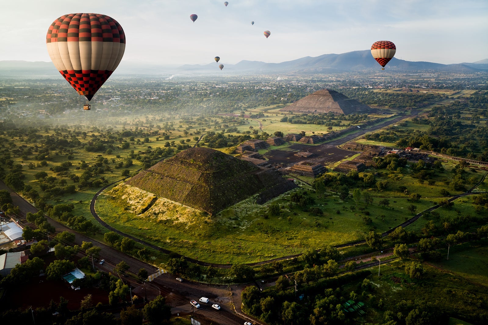 hot air flying in the sky at Teotihuacan