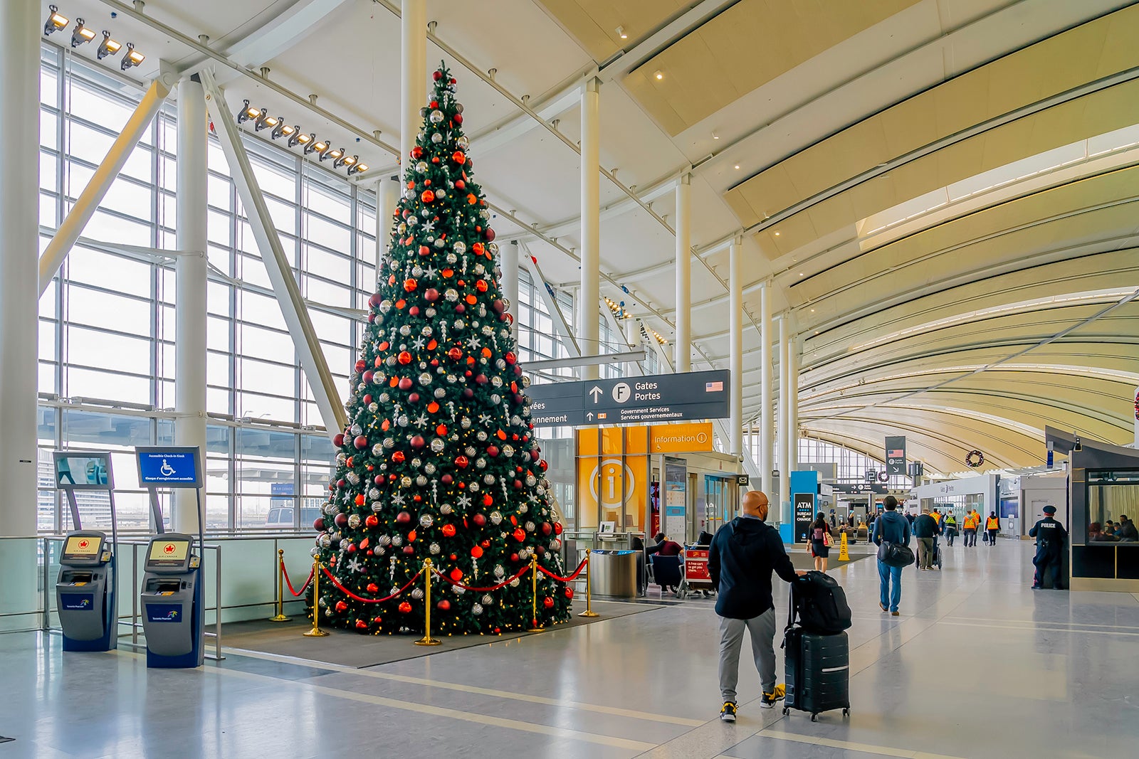 A passenger passed by a Christmas tree at Pearson Airport in Toronto.