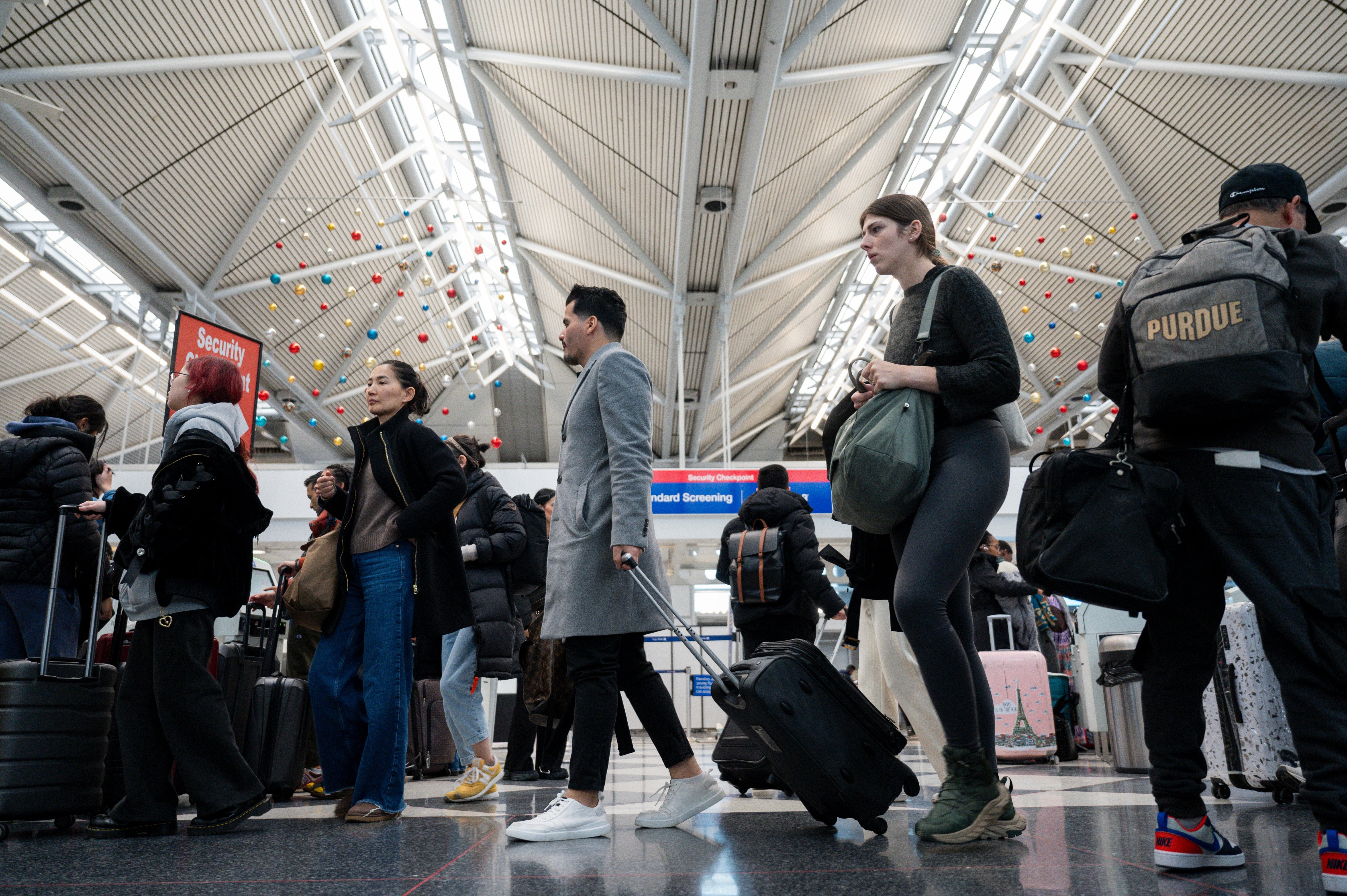 Travelers At ORD Airport Ahead Of Christmas Holiday