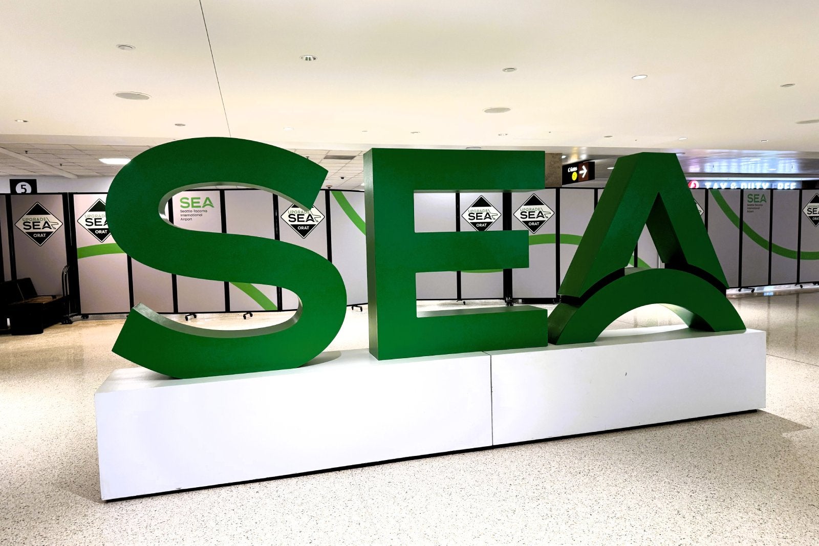 1_SEA letters. Barriers between the old and new parts of Concourse C at SEA Airport came down June 11